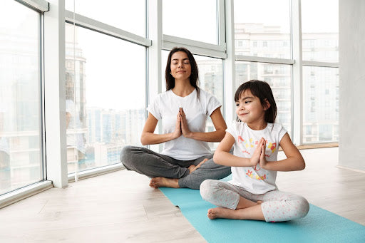 How To & Why Incorporate Yoga + Other Ancient Wellness Techniques Into Your Child's Life